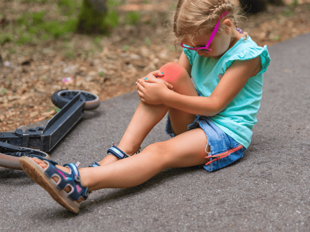 POBAR pediatric specialist gently examining a child’s leg to distinguish growing pains from injury pain in Brandon.